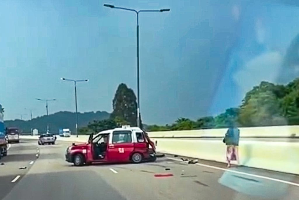 The two taxi drivers were talking on the highway before getting hit, police said. Photo: Facebook/Bosco Chu The two taxi drivers were talking on the highway before getting hit, police said. Photo: Facebook/Bosco Chu