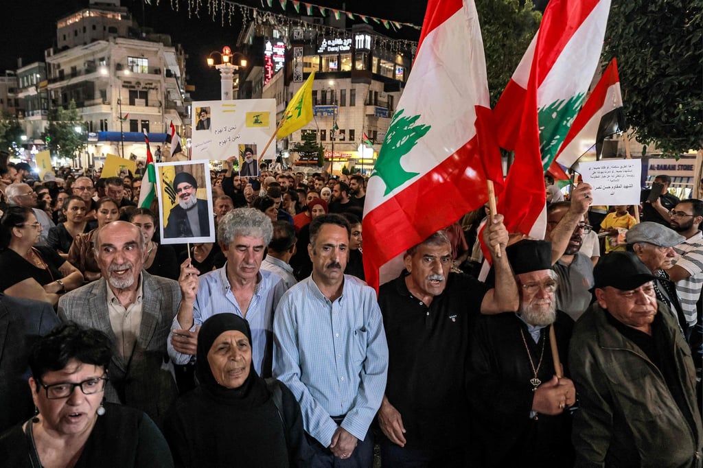Protesters gather in the West Bank city of Ramallah on Saturday after Hezbollah confirmed the death of its leader Hassan Nasrallah in an Israeli air strike in Beirut the previous day. Photo: AFP