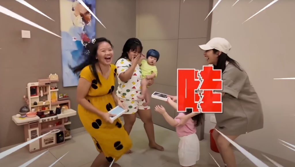 The pair could not contain their joy when presented with the phones. Photo: YouTube/@Jeff & Inthira