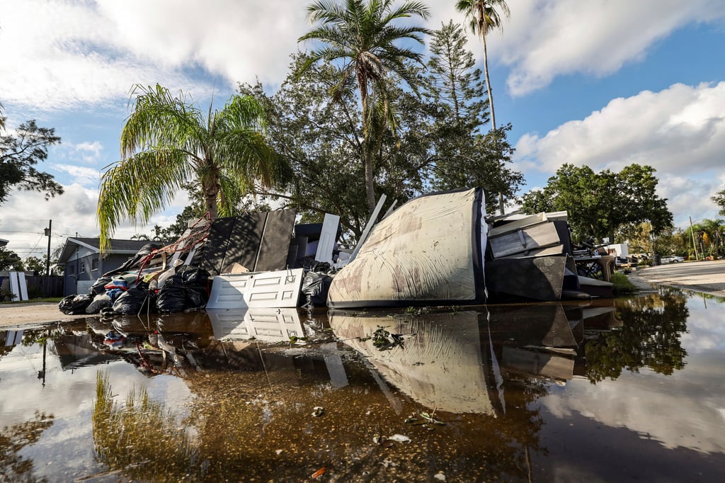 Residents discard items from their homes which filled with floodwaters from Hurricane Helene in the Shore Acres neighbourhood of St Petersburg, Florida. Photo: AP Residents discard items from their homes which filled with floodwaters from Hurricane Helene in the Shore Acres neighbourhood of St Petersburg, Florida. Photo: AP