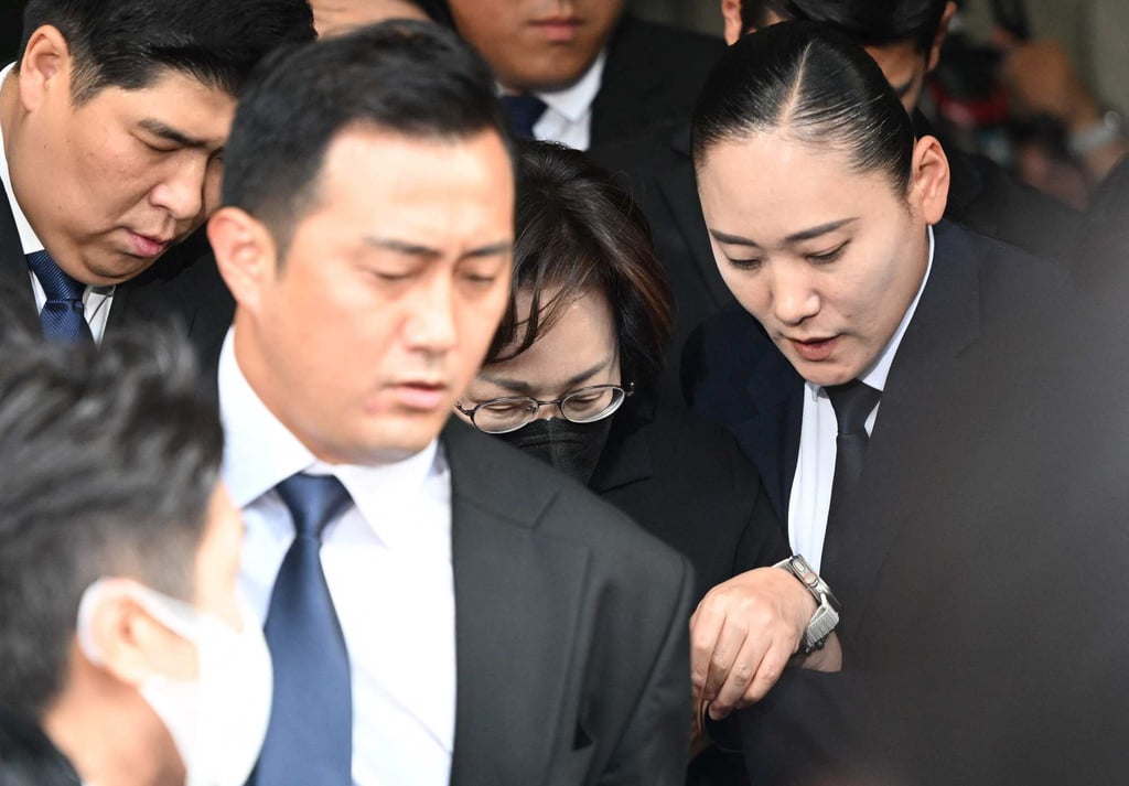 Yongsan official Park Hee-young (centre, black mask) is surrounded by bodyguards as she exits Seoul Western District Court on Monday. Photo: AFP Yongsan official Park Hee-young (centre, black mask) is surrounded by bodyguards as she exits Seoul Western District Court on Monday. Photo: AFP