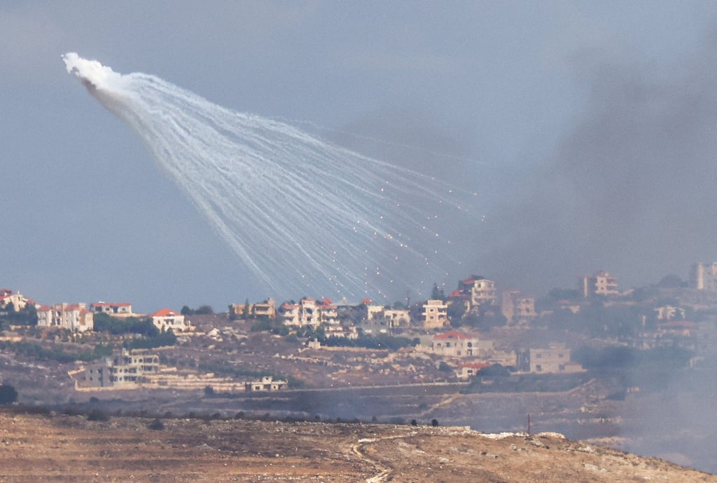 Israeli artillery shelling in southern Lebanon, as seen from Jish, northern Israel. Photo: Reuters Israeli artillery shelling in southern Lebanon, as seen from Jish, northern Israel. Photo: Reuters