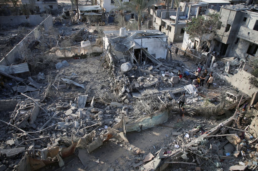 Palestinians inspect the aftermath of Israeli strikes on houses in Khan Younis in the southern Gaza Strip. Photo: Reuters Palestinians inspect the aftermath of Israeli strikes on houses in Khan Younis in the southern Gaza Strip. Photo: Reuters
