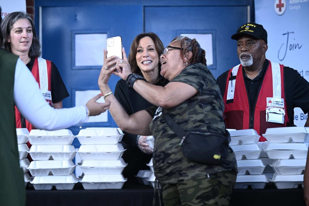 US Vice-President Kamala Harris poses for a photo with a woman as she hands out food to people in Augusta, Georgia, on Wednesday. Photo: AFP