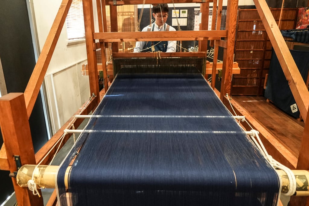 A weaver operates a handloom at Momotaro Jeans in Kojima. Photo: AP A weaver operates a handloom at Momotaro Jeans in Kojima. Photo: AP