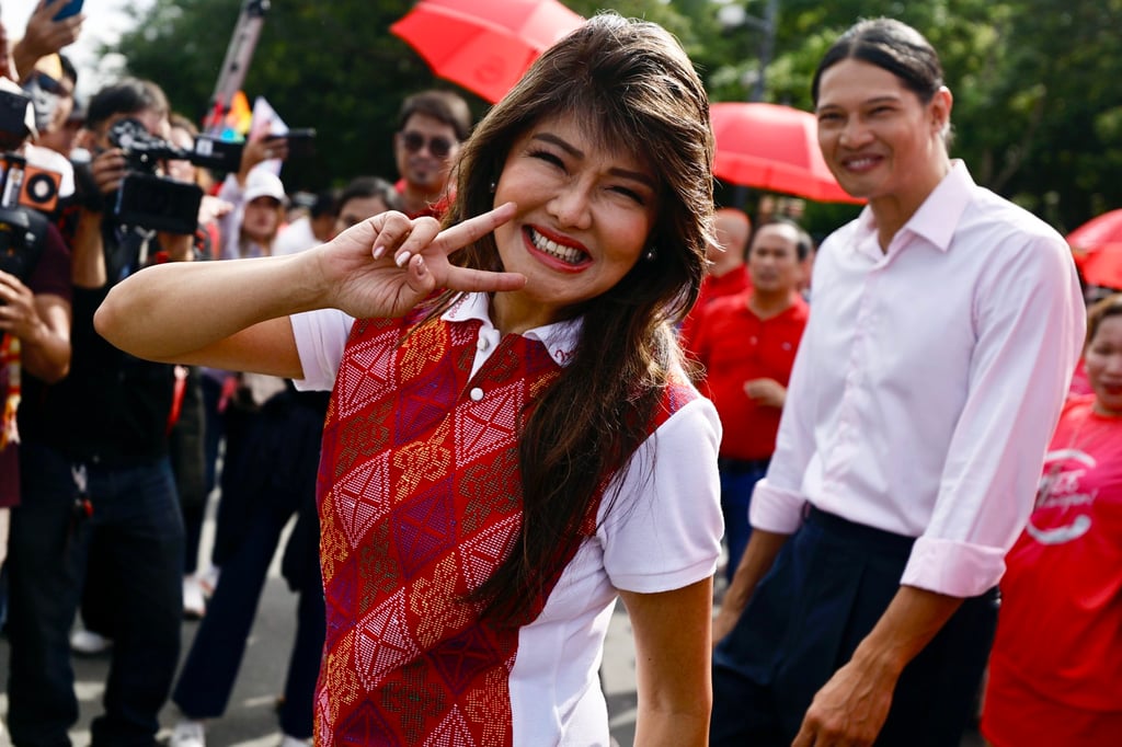 Senator Imee Marcos, the president’s sister, gestures as she enters the elections commission office in Manila to file her certificate of candidacy on Wednesday. Photo: EPA-EFE Senator Imee Marcos, the president’s sister, gestures as she enters the elections commission office in Manila to file her certificate of candidacy on Wednesday. Photo: EPA-EFE
