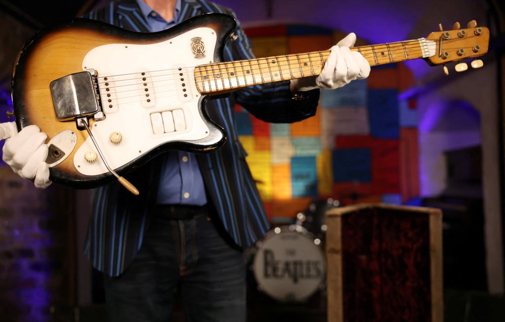Martin Nolan of Julien’s Auctions holds a Futurama guitar that used to belong to the late George Harrison, former member of The Beatles at a press announcement of its auction. Photo: Reuters Martin Nolan of Julien’s Auctions holds a Futurama guitar that used to belong to the late George Harrison, former member of The Beatles at a press announcement of its auction. Photo: Reuters