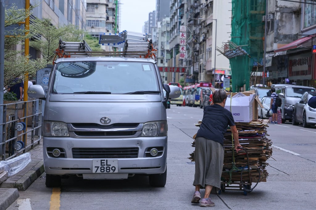 A scavenger pushes a trolley full of recyclables along the streets of Hong Kong’s Mong Kok district. Photo: Jelly Tse