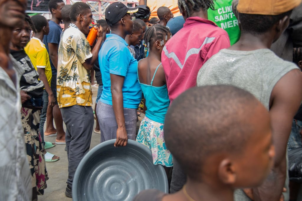People wait for a food at a camp for displaced persons in Port-au-Prince, Haiti, on Wednesday. Photo: AFP People wait for a food at a camp for displaced persons in Port-au-Prince, Haiti, on Wednesday. Photo: AFP
