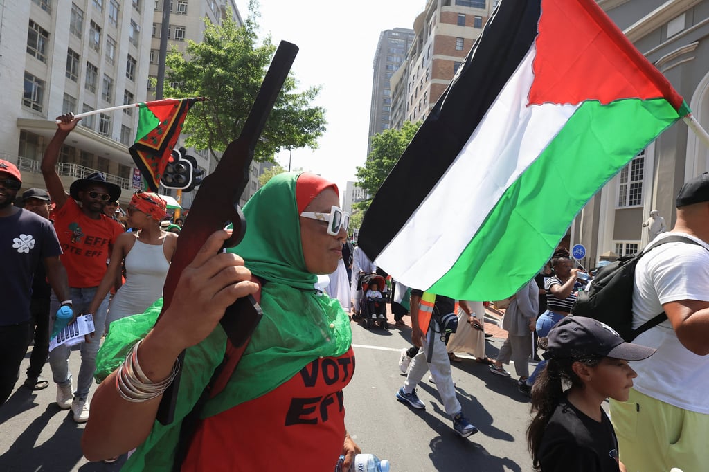 A person holds a makeshift weapon during a protest to show support for Palestinians in Gaza, in Cape Town, South Africa on Saturday. Photo: Reuters A person holds a makeshift weapon during a protest to show support for Palestinians in Gaza, in Cape Town, South Africa on Saturday. Photo: Reuters