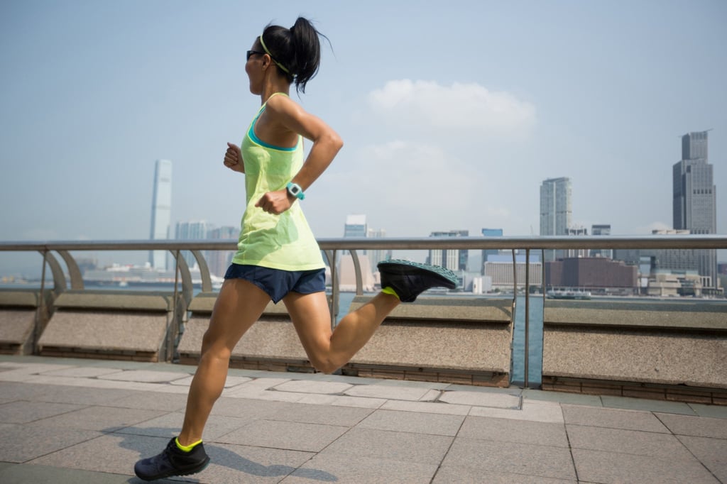 A jogger on the harbourfront on Hong Kong Island. The development provides direct access to the newly expanded waterfront promenade.