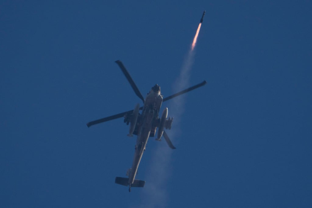 An Israeli Apache helicopter fires a missile towards southern Lebanon. Photo: AP An Israeli Apache helicopter fires a missile towards southern Lebanon. Photo: AP