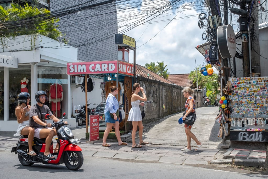 Foreign tourists in Canggu, Bali, Indonesia. Bali issued an advisory in June urging holidaymakers to dress appropriately, avoid defiling sacred sites and refrain from engaging in illegal business activities. Photo: EPA-EFE