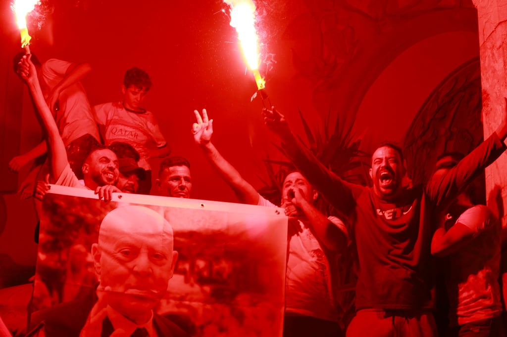 Supporters of Saied celebrate after the announcement of provisional results for the presidential elections in Tunis, Tunisia on Sunday. Photo: AP