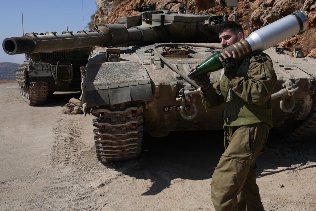 An Israeli reserve soldier at a tank staging area near northern Israeli border with Lebanon. Photo: Ayal Margolin/JINI via Xinhua An Israeli reserve soldier at a tank staging area near northern Israeli border with Lebanon. Photo: Ayal Margolin/JINI via Xinhua