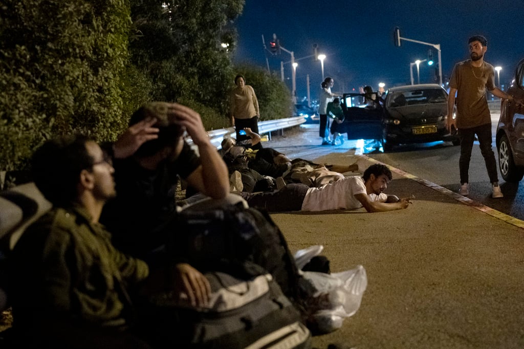 Israelis take cover during Iran’s October 1 missile attack. Photo: AP Israelis take cover during Iran’s October 1 missile attack. Photo: AP