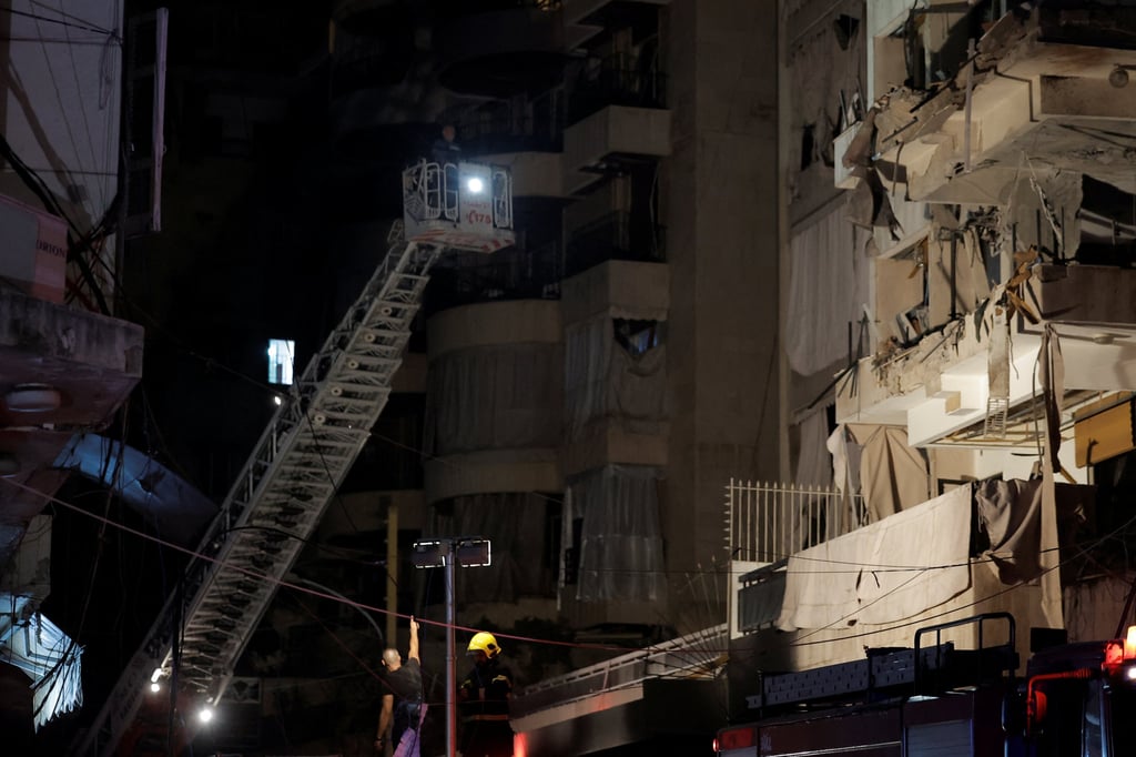 A rescuer stands next to a damaged building at the site of an Israeli air strike in Ras Al- Nabaa, Beirut, Lebanon on Thursday. Photo: Reuters A rescuer stands next to a damaged building at the site of an Israeli air strike in Ras Al- Nabaa, Beirut, Lebanon on Thursday. Photo: Reuters