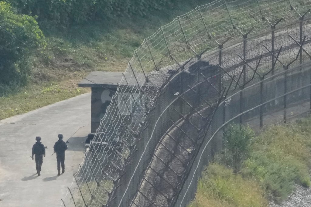 South Korean soldiers patrol along a barbed wire fence in Paju, near the border with North Korea, on Thursday. Photo: AP South Korean soldiers patrol along a barbed wire fence in Paju, near the border with North Korea, on Thursday. Photo: AP