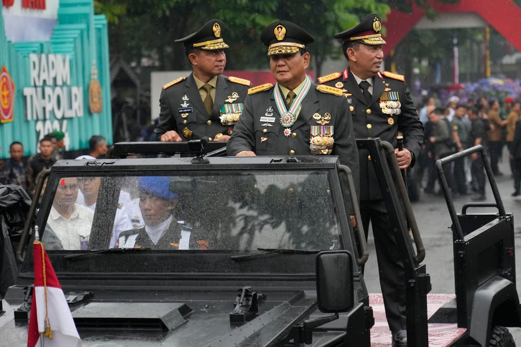 Prabowo takes part in a military inspection in February after being made an honorary four-star general by President Joko Widodo. Photo: AP Prabowo takes part in a military inspection in February after being made an honorary four-star general by President Joko Widodo. Photo: AP