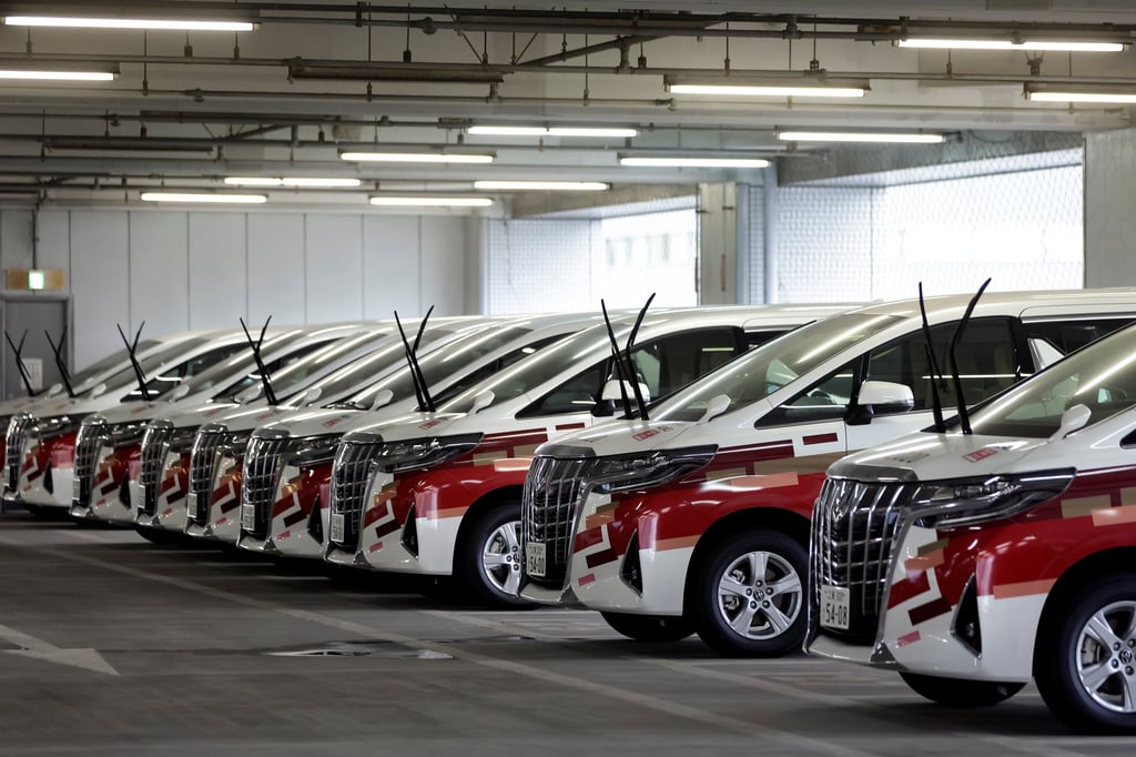 Toyota minivans at a car park during a demonstration of the transport operation support system for the Tokyo 2020 Olympic Games personnel in July 2021. Photo: Pool via Reuters Toyota minivans at a car park during a demonstration of the transport operation support system for the Tokyo 2020 Olympic Games personnel in July 2021. Photo: Pool via Reuters