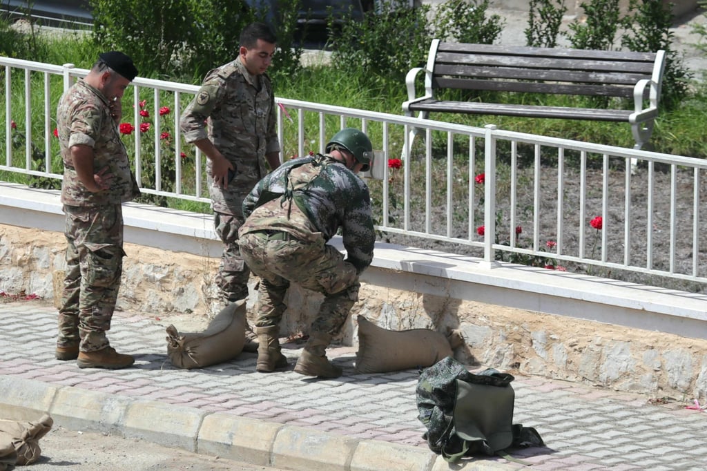 Lebanese soldiers prepare to destroy a device in a controlled explosion in southern Lebanon. Photo: AFP Lebanese soldiers prepare to destroy a device in a controlled explosion in southern Lebanon. Photo: AFP