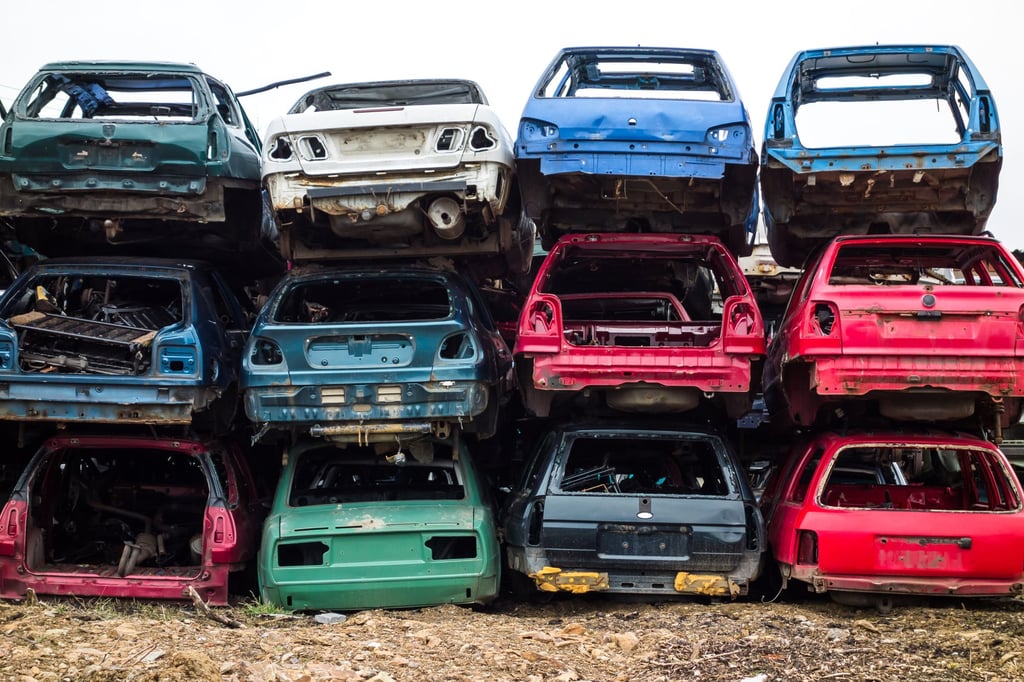 Car bodies stacked at a scrapyard. Recycling materials used in making cars are becoming increasingly important in the automotive industry. Photo: Shutterstock