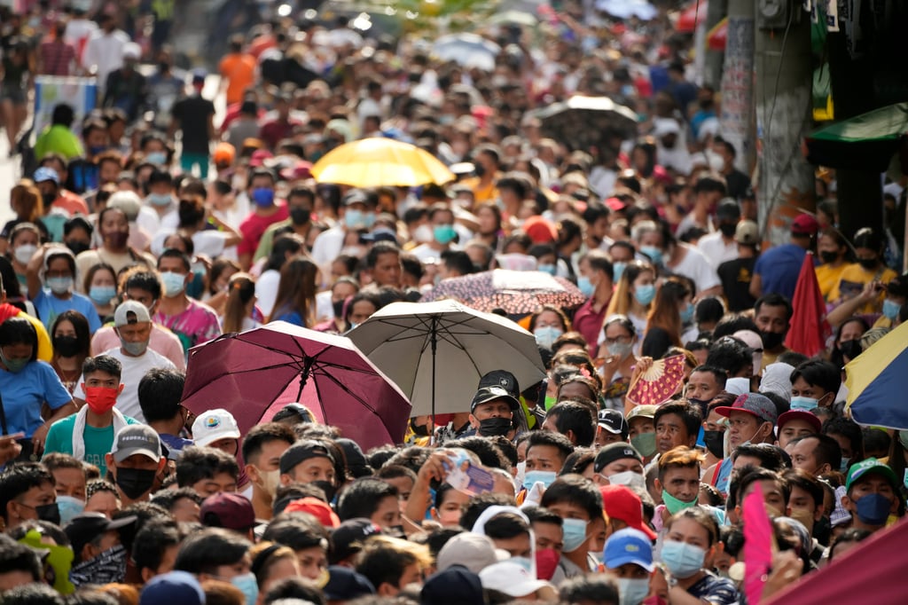 People wait in line to vote at a school in Manila in 2022. The vast majority of Filipinos will not support politicians with pro-China views in next year’s midterm elections, according to a new survey. Photo: AP People wait in line to vote at a school in Manila in 2022. The vast majority of Filipinos will not support politicians with pro-China views in next year’s midterm elections, according to a new survey. Photo: AP