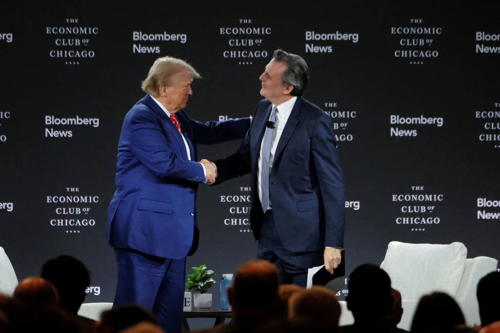 Donald Trump shakes hands with Bloomberg Editor-in-Chief John Micklethwait. Photo: Reuters Donald Trump shakes hands with Bloomberg Editor-in-Chief John Micklethwait. Photo: Reuters
