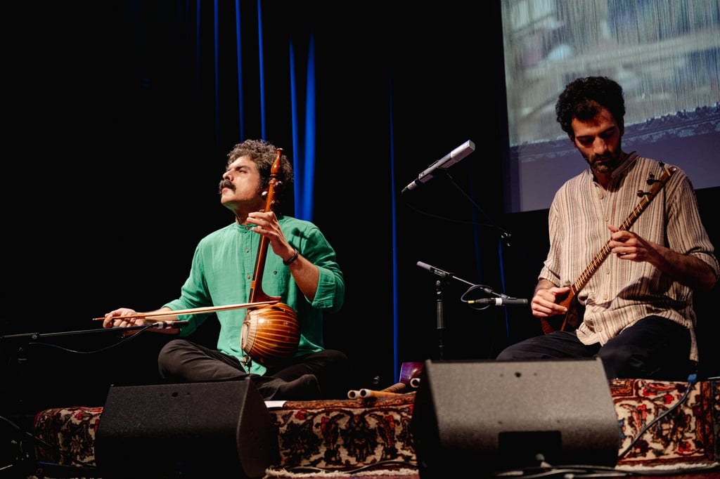Mehdi Aminian and his ensemble will play traditional Persian tunes while performing The Woven Sounds, including two string instruments such as setar (right, held by Aminian) and kamancheh. Photo: Liudmila Jeremies