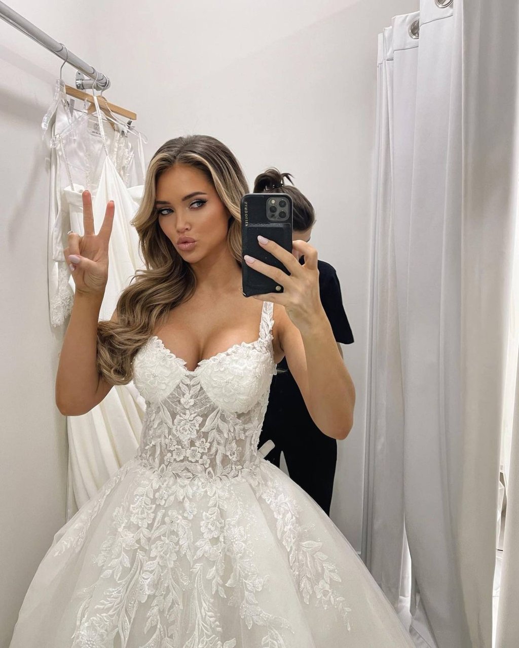 Kourtney Kellar trying on wedding gowns. Photo: @kourtney_kellar/Instagram