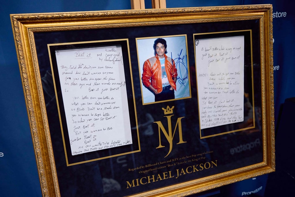 Framed Beat It lyrics, handwritten by Michael Jackson, will go under the hammer on November 15 during the Propstore auction. Photo: AFP Framed Beat It lyrics, handwritten by Michael Jackson, will go under the hammer on November 15 during the Propstore auction. Photo: AFP
