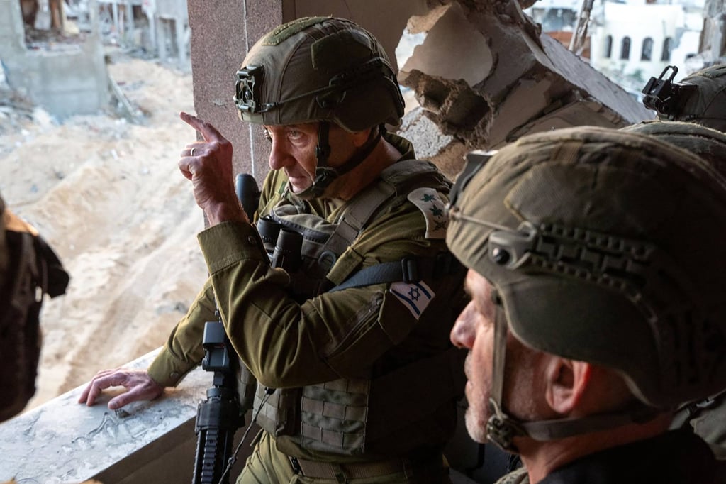 Israel’s Chief of the General Staff Lieutenant-General Herzi Halevi (left) and the head of the Israeli Security Agency Ronen Bar visit what the army says is the location where Yahya Sinwar was killed on Thursday. Photo: Israeli Army via AFP