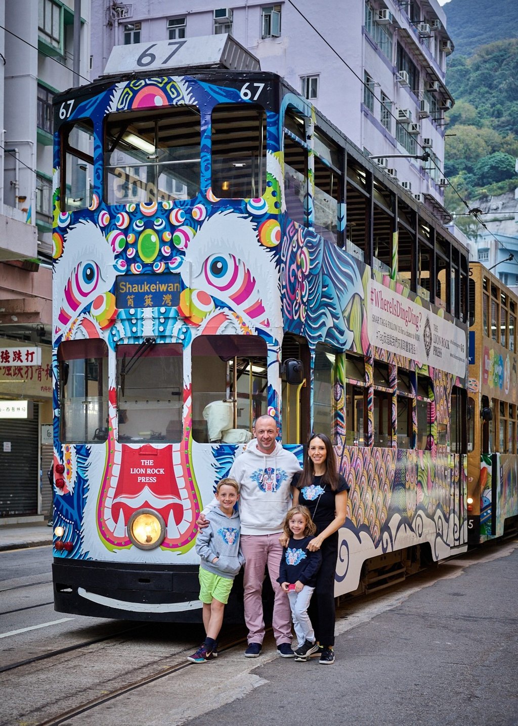 Claire Yates, her husband Andrew, and her children Miller and Leila in front of “Ding Ding The Dragon”, The Lion Rock Press Tram in Shau Kei Wan, Hong Kong, in 2021. Photo: courtesy of Claire Yates