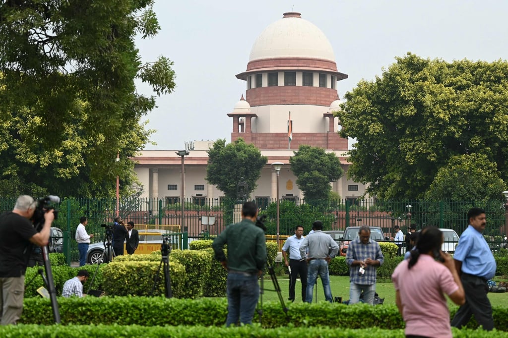 People gather outside the Supreme Court of India in New Delhi. Photo: AFP