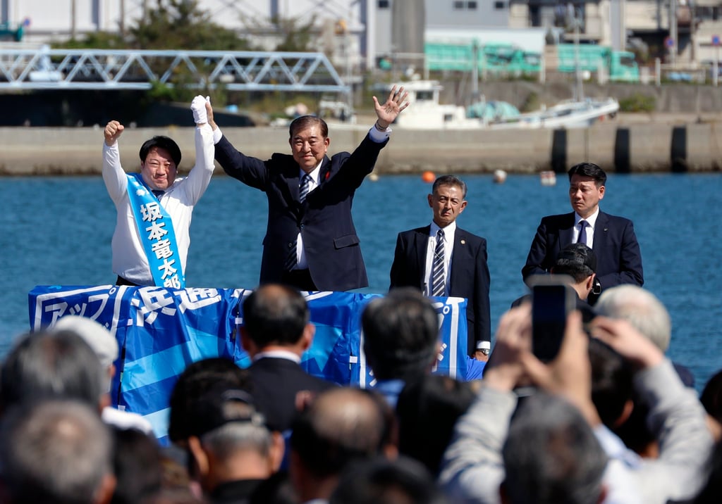 Shigeru Ishiba (second from left) campaigns with an LDP candidate during a rally in Fukushima prefecture on Tuesday. Photo: EPA-EFE