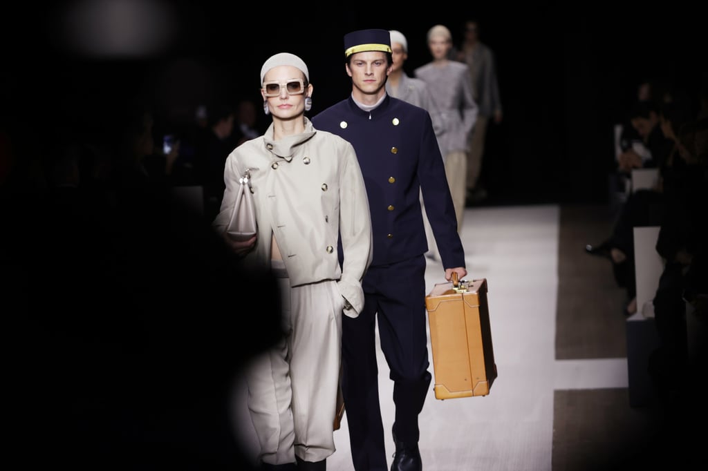 The Giorgio Armani spring/summer 2025 show opened with a model followed by a porter carrying her suitcases. Photo: Getty Images
