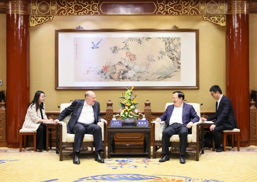 Xia Baolong (second from the right), director of the Hong Kong and Macau Affairs Office, meets HSBC group chairman Mark Tucker (second from the left) in Beijing. Photo: Handout