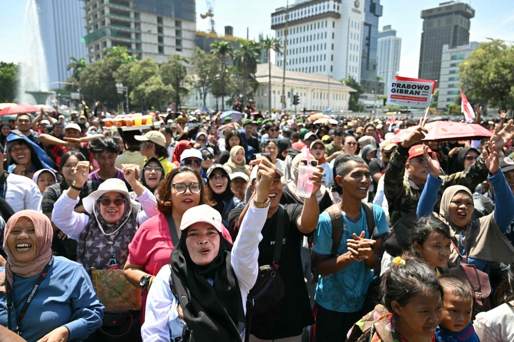 Well-wishers gather outside the Presidential Palace as they wait for the inauguration of Indonesia’s new leader Prabowo Subianto in Jakarta on Sunday. Photo: AFP Well-wishers gather outside the Presidential Palace as they wait for the inauguration of Indonesia’s new leader Prabowo Subianto in Jakarta on Sunday. Photo: AFP