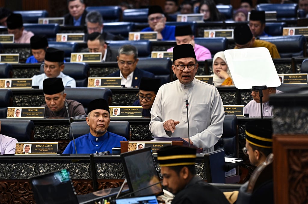 Anwar Ibrahim, Malaysia’s prime minister and finance minister, delivers the 2025 budget speech at parliament in Kuala Lumpur on Friday. Photo: Malaysia Department of Information via AP Anwar Ibrahim, Malaysia’s prime minister and finance minister, delivers the 2025 budget speech at parliament in Kuala Lumpur on Friday. Photo: Malaysia Department of Information via AP