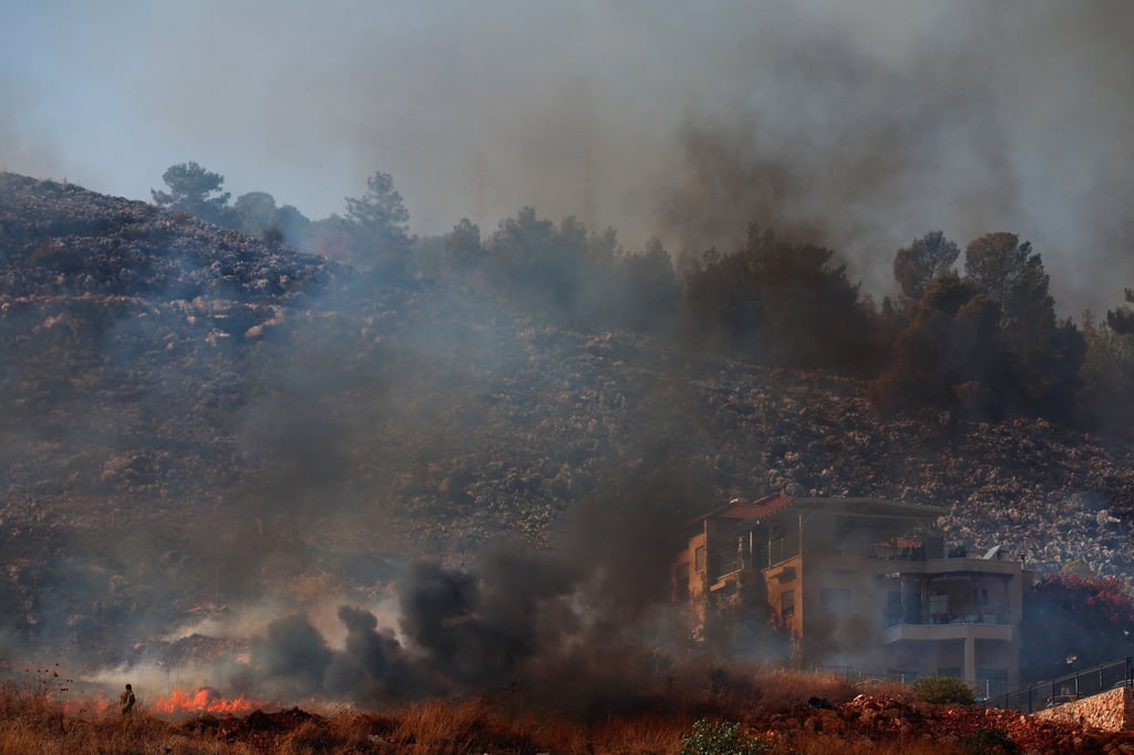 Fire following a rocket impact near Rosh Pina, northern Israel. Photo: Reuters Fire following a rocket impact near Rosh Pina, northern Israel. Photo: Reuters