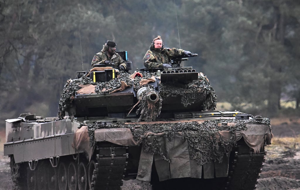 German Defence Minister Boris Pistorius rides a tank as he visits the Leopard II tanks that are due to be supplied to Ukraine, in Augustdorf, Germany, in February 2023. Photo: Reuters
