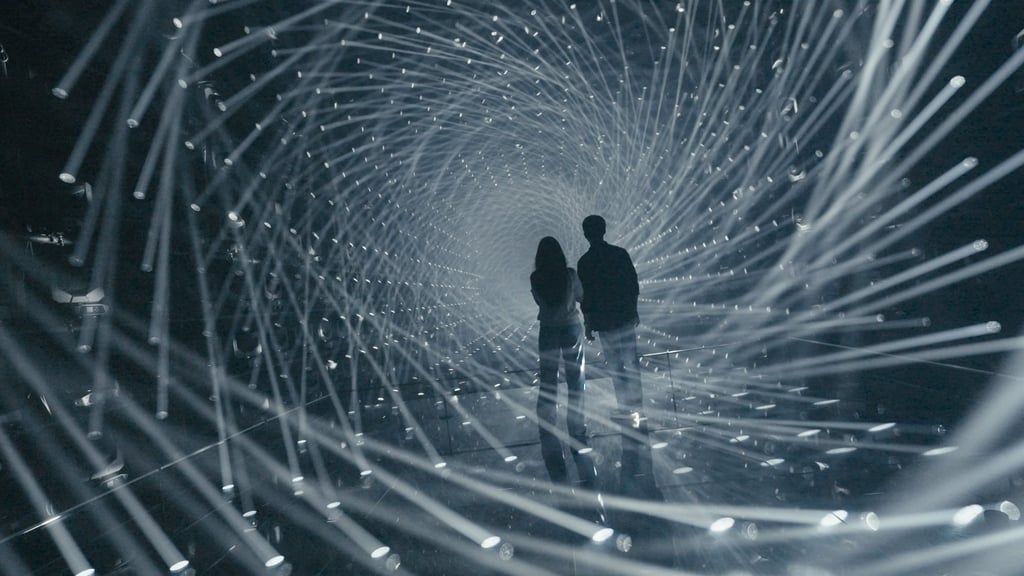 Travel influencers Sophie Kim (left) and Stanley Chen immerse themselves in one of the digital art installations at Tokyo’s TeamLab Borderless museum.