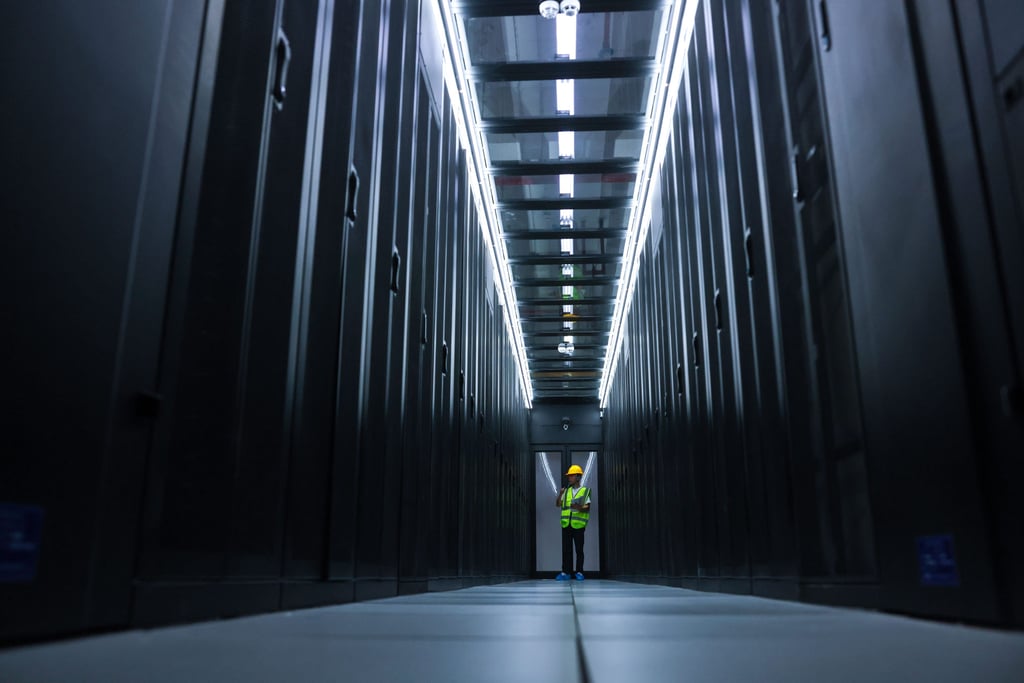 A staff member checks equipment at a China Mobile data centre in southwest China’s Guizhou province, May 24, 2022. Photo: Xinhua