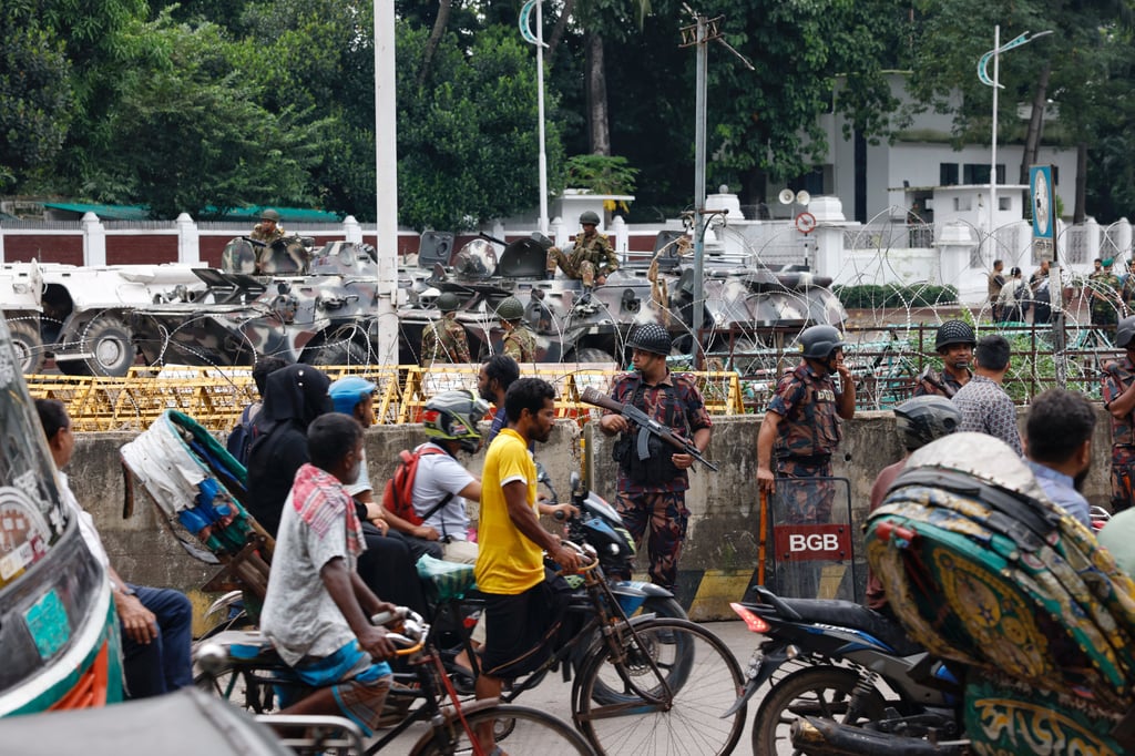 Security personnel stand guard in front of the Bangabhaban, the residence and workplace of President Mohammed Shahabuddin. Photo: Reuters