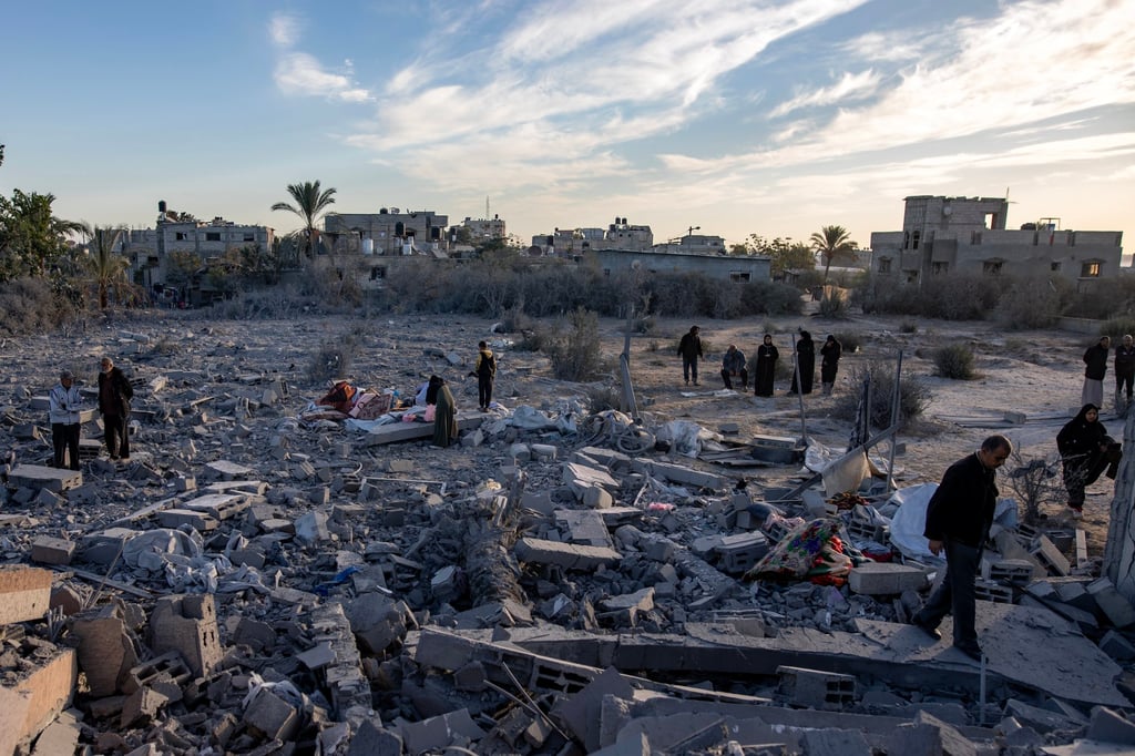 Palestinians inspect the remains of destroyed buildings following the Israeli air strikes in Khan Younis. Photo: EPA-EFE