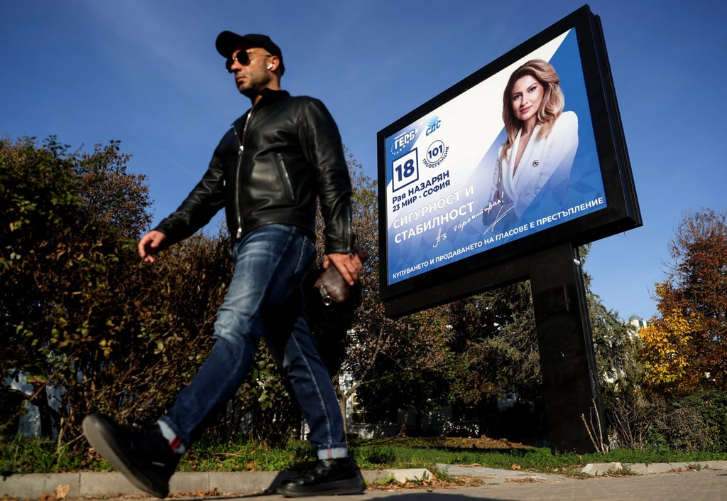 A man passes by a campaign billboard of the centre-right GERB party in Sofia, Bulgaria. Photo: EPA-EFE