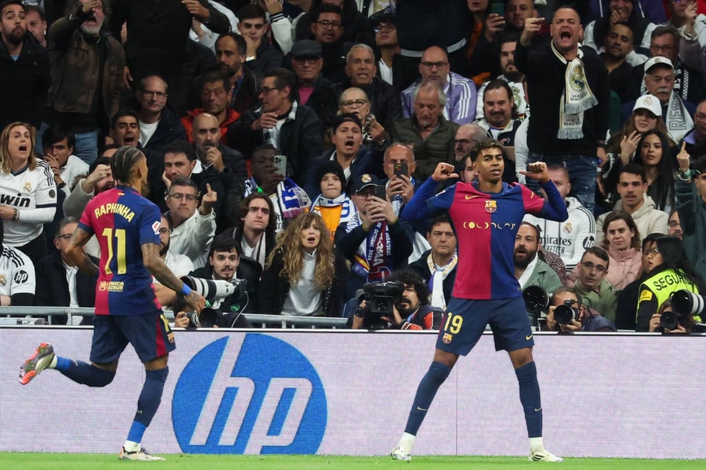 Lamine Yamal (right) celebrates scoring his side’s third. Photo: AFP