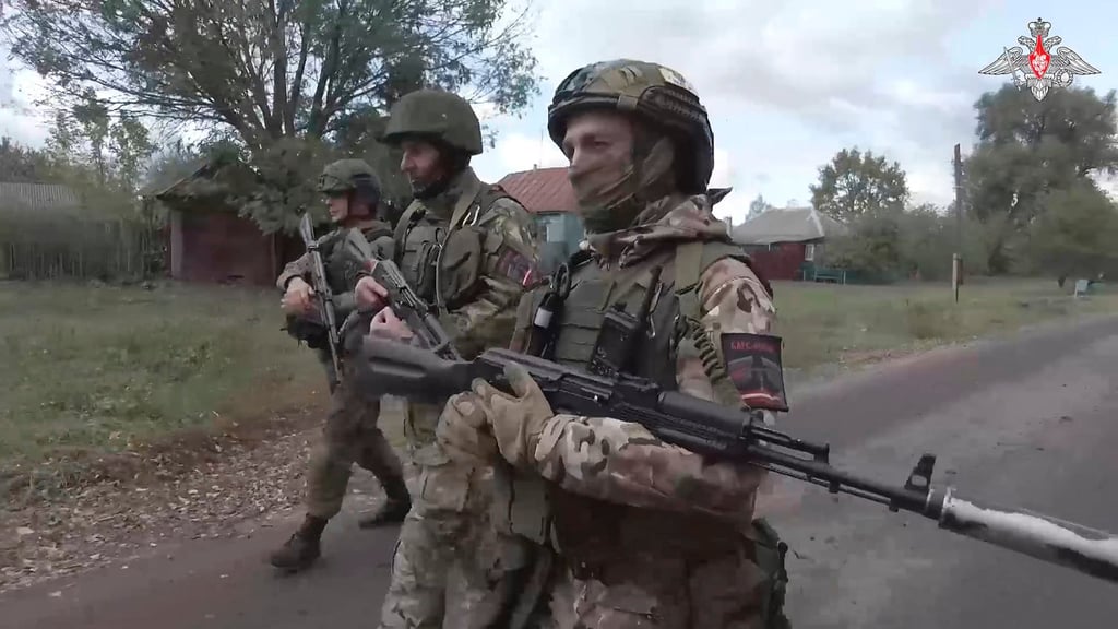 Russian soldiers patrol a village in the Russian-Ukrainian border area in the Kursk region, Russia. Photo: Russian Defence Ministry Press Service via AP