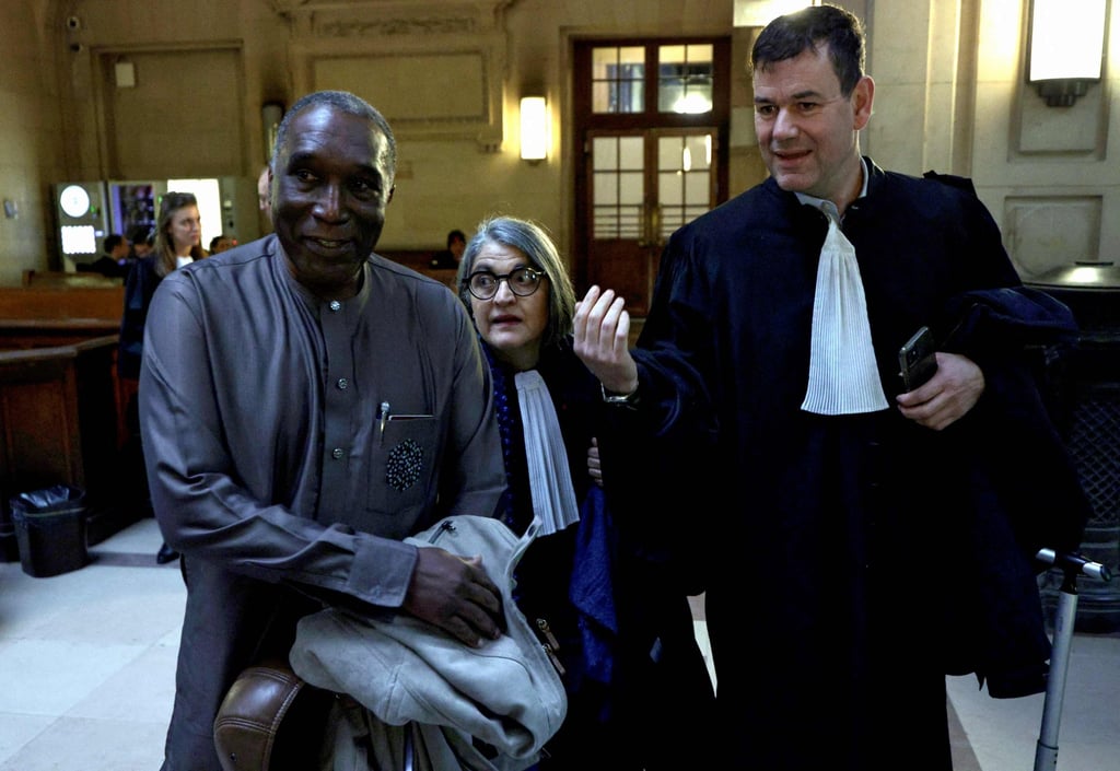Eugene Rwamucyo with his lawyers at Paris Assize Court on October 1. Photo: AFP