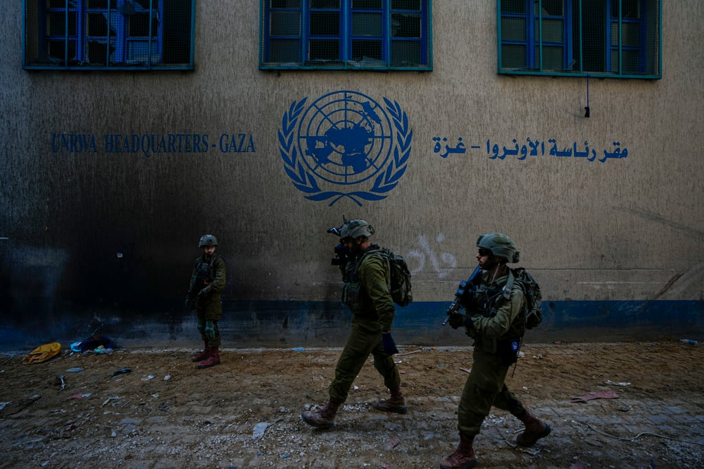 Israeli soldiers take position outside UNRWA headquarters in Gaza. Photo: AP